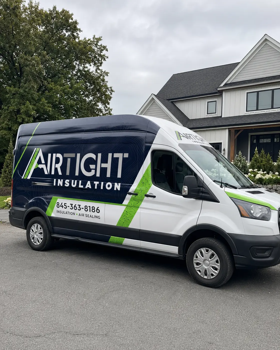 AirTight Insulation branded service van at a residential property